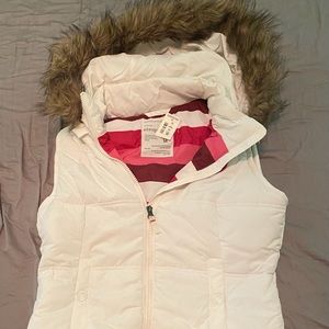 White puffy vest with faux fur trimmed hoodie